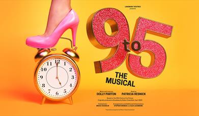 pink high heel on alarm clock