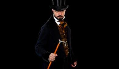 Man in top hat, holding cane, looking down camera