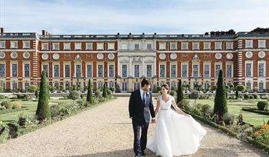 Bride and Groom in Hampton Palace Court grounds