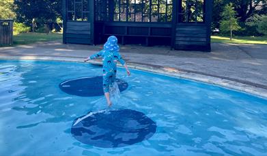 Splashing at Stoke Park paddling Pool