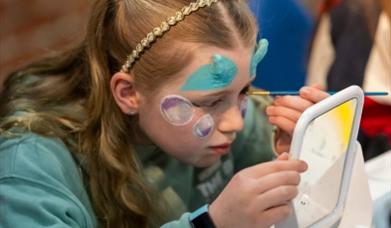 Young girl with blue special effects make up on