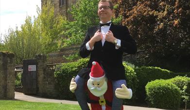 Paul Kerensa smiling at camera with a santa hat on