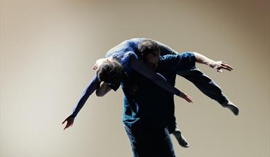 2 dancers - one lifting the other