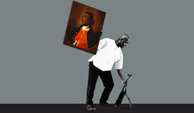 Man holding a piece of artwork above his head