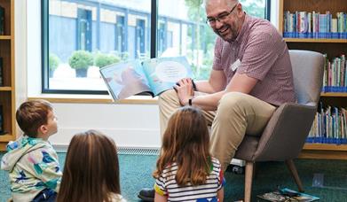 Pre-schoolers enjoying a story in the library