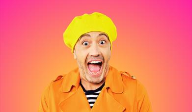 actor in a yellow hat